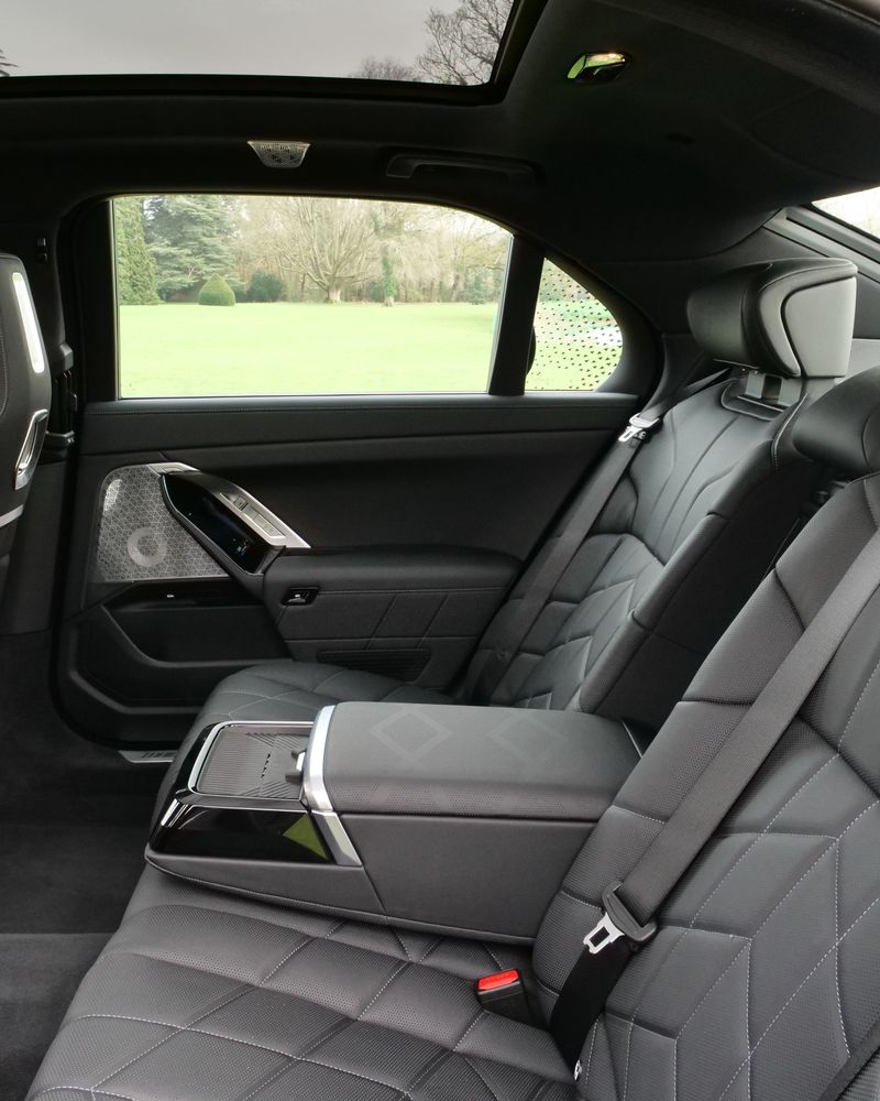 Leather rear seats and centre armrest in an executive saloon
